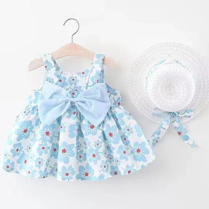 Baby girl in a white and pink floral bow summer dress, knee-length, perfect for toddlers.