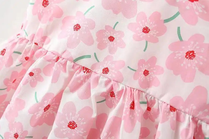 Floral summer dress set for baby girls, white with pink flowers and a matching hair bow.