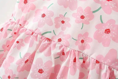 Floral summer dress set for baby girls, white with pink flowers and a matching hair bow.