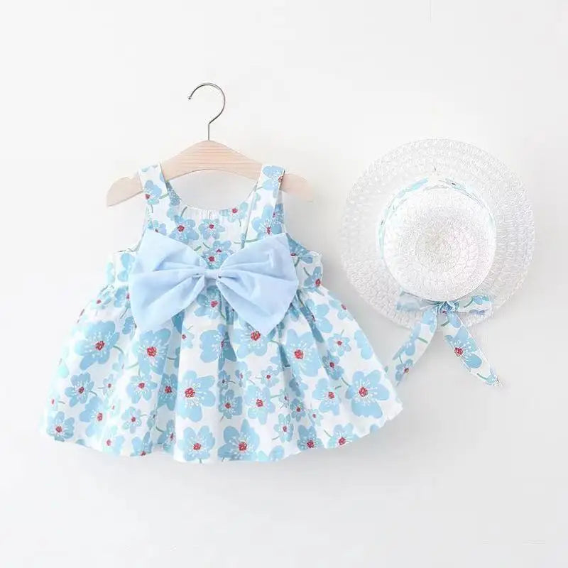 Baby girl's white summer dress with all-over pink floral print and a large front bow.
