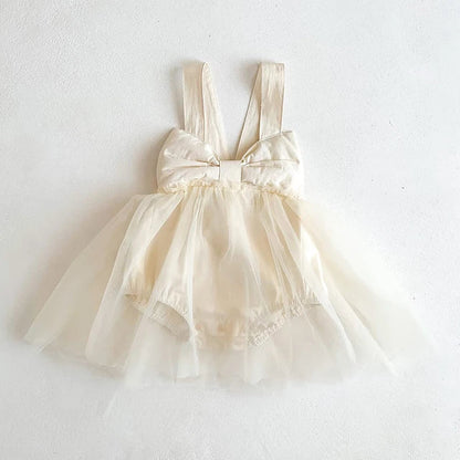 Baby girl in apricot cotton romper dress, perfect for summer comfort and infant fashion