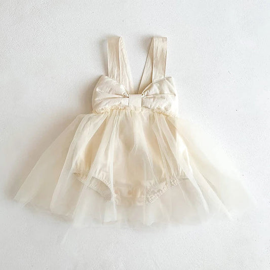 Baby girl in apricot cotton romper dress, perfect for summer comfort and infant fashion