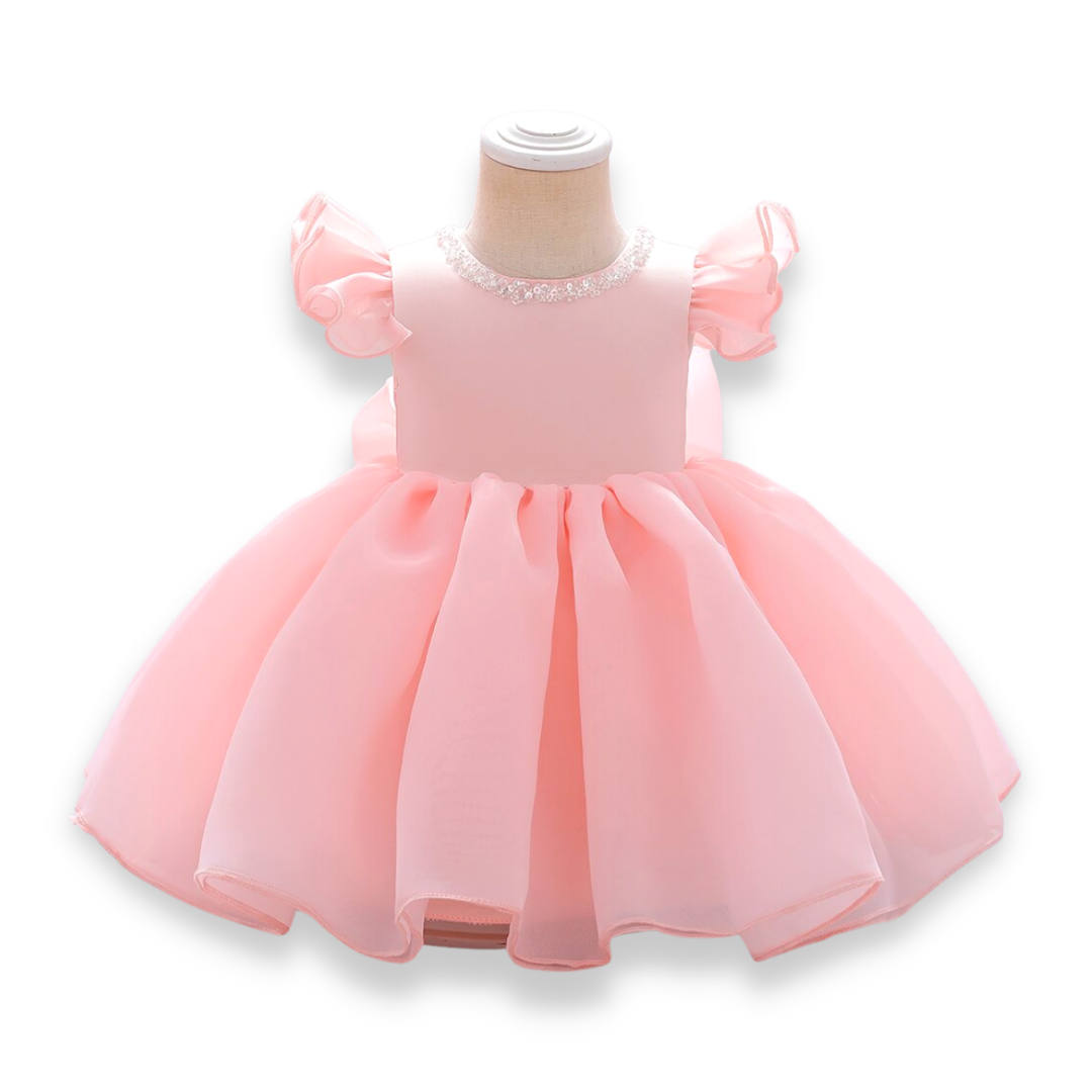 Infant formal wear: light blue ball gown with beaded neckline and big back bow, studio shot.