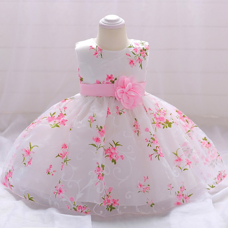 Close-up of the intricate beaded detail on the bodice of a baby girl's princess special occasion dress.