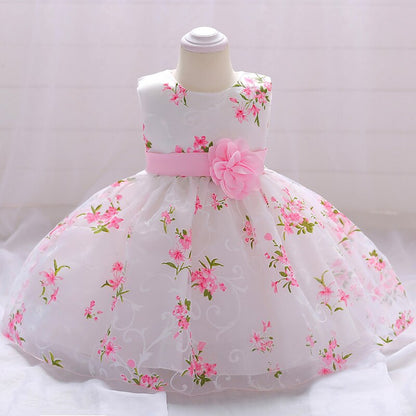 Close-up of the intricate beaded detail on the bodice of a baby girl's princess special occasion dress.