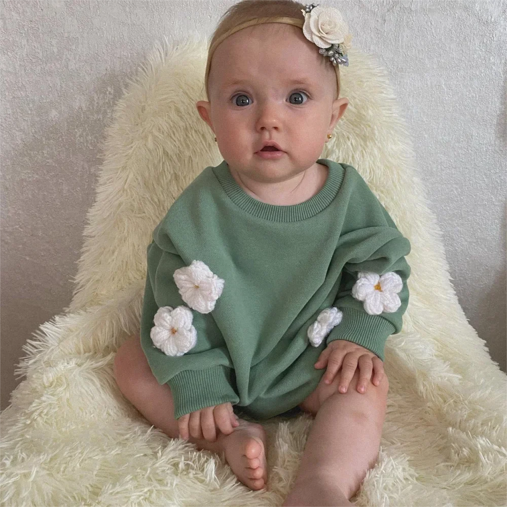 Infant wearing a cute floral spring sweatshirt romper, long sleeves, perfect for baby girls
