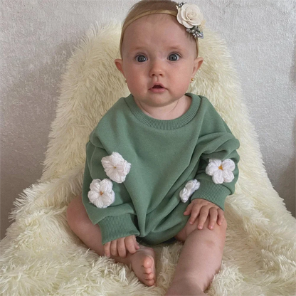 Infant wearing a cute floral spring sweatshirt romper, long sleeves, perfect for baby girls