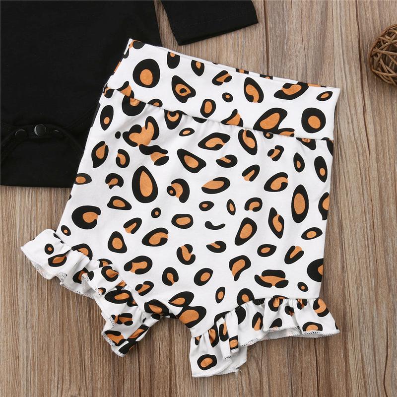 Baby girl wearing a stylish leopard print romper and shorts, comfortable infant bodysuit.