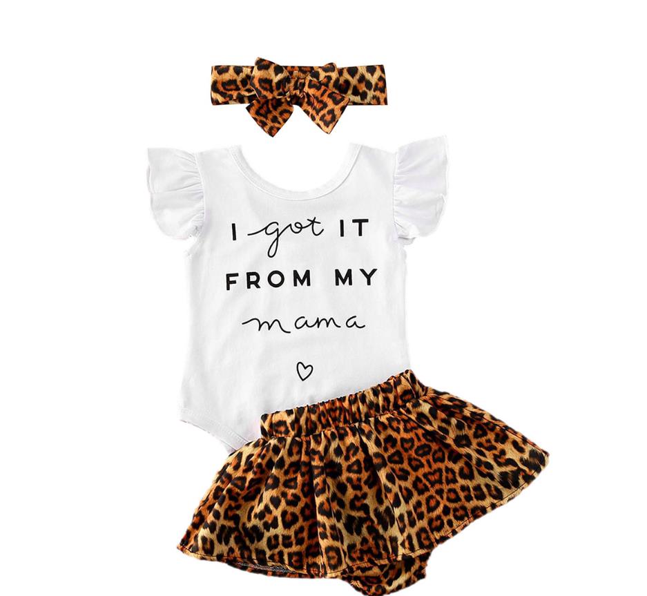 Detail of the elastic waistband on leopard print baby shorts, comfortable infant fashion.