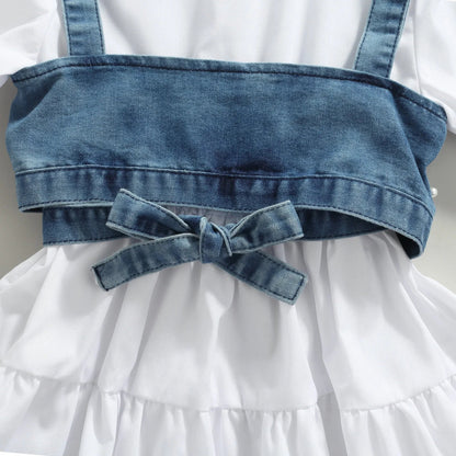 Girls two-piece outfit: white long sleeve dress with floral print & blue beaded denim vest.
