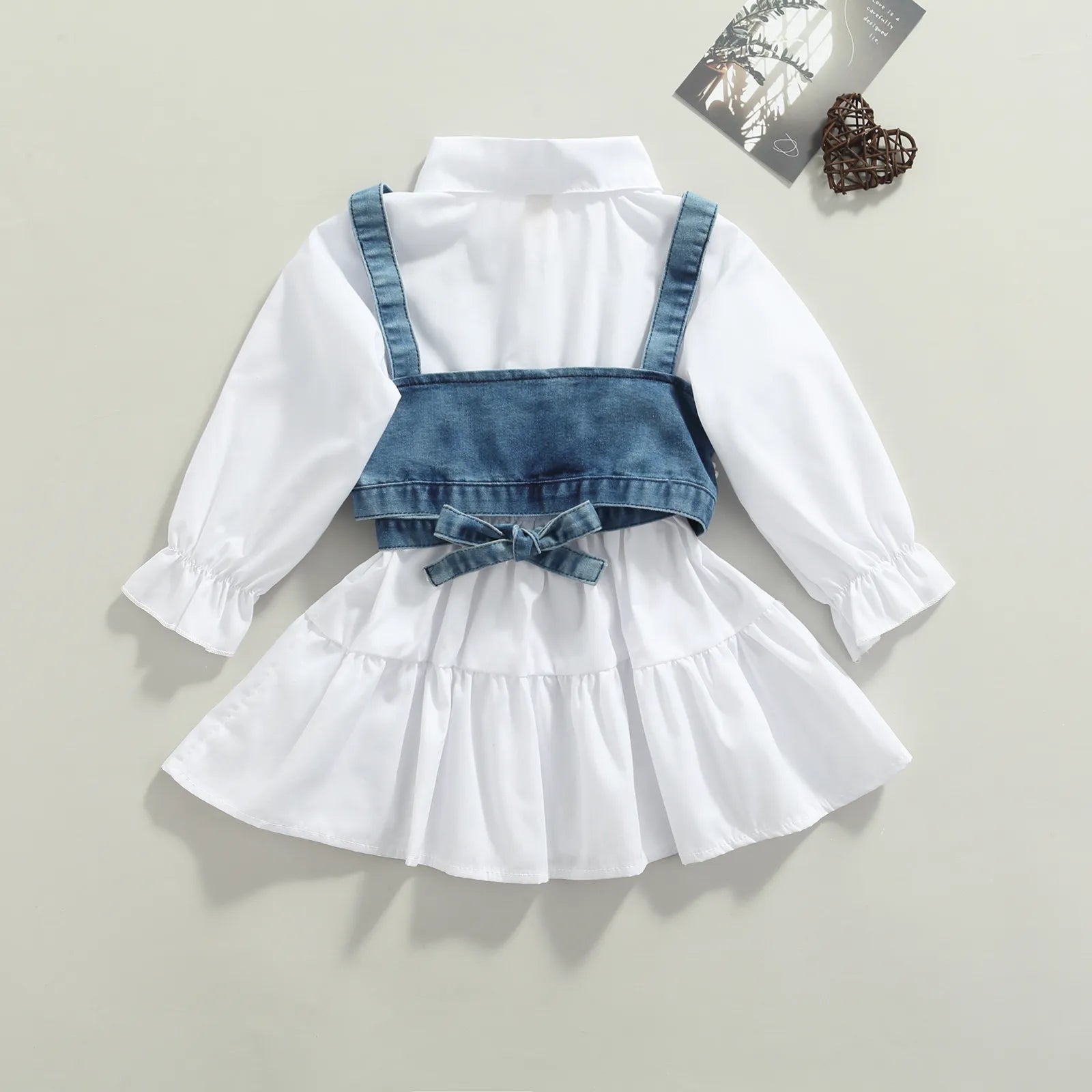Complete baby girl set featuring a comfortable long sleeve dress and fashionable denim vest.