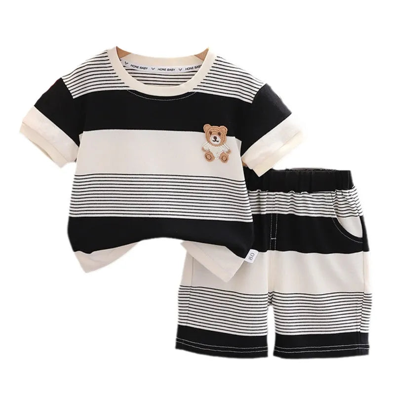Baby girl in pink and white striped cotton tracksuit set, comfortable summer outfit for toddlers