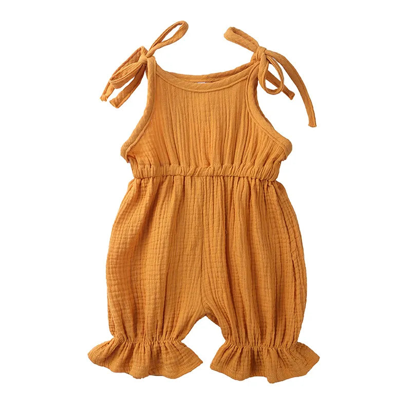 Assortment of baby girl cotton sleeveless rompers in various colors and prints.