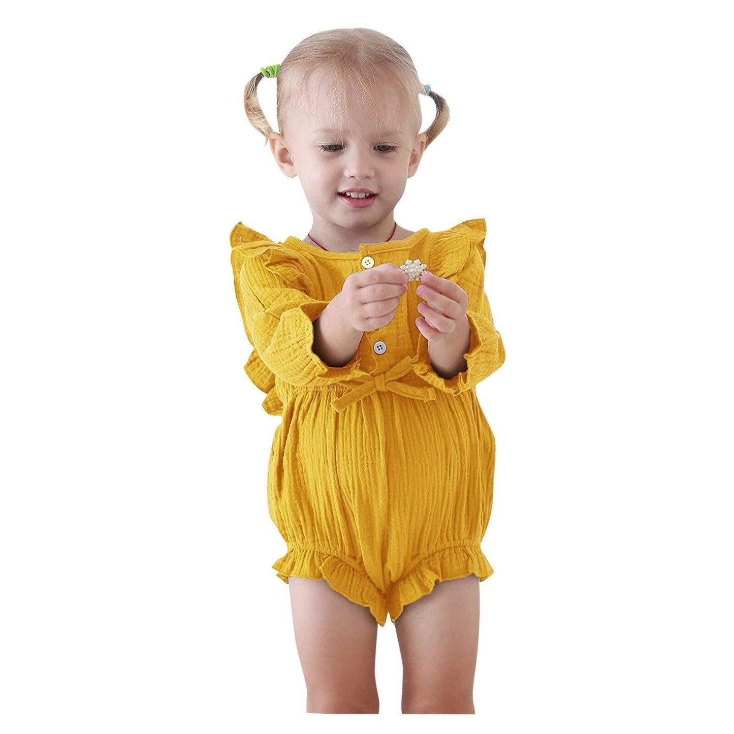 Cute baby girl in a comfortable cotton blend ruffle romper,bowtie accent, a lovely baby gift.