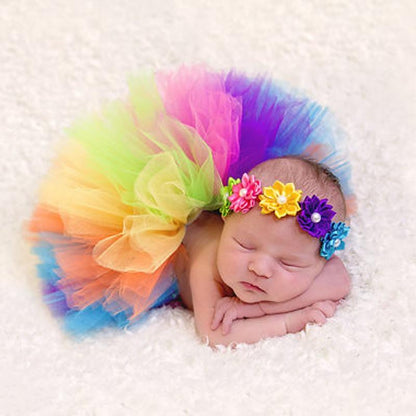 Soft pink tulle tutu skirt with an elastic waistband and a decorative headband for baby girls.