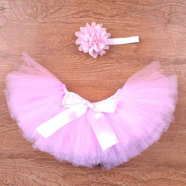 Baby girl princess dress-up set: pink tutu skirt and coordinating headband, great for toddler wear.
