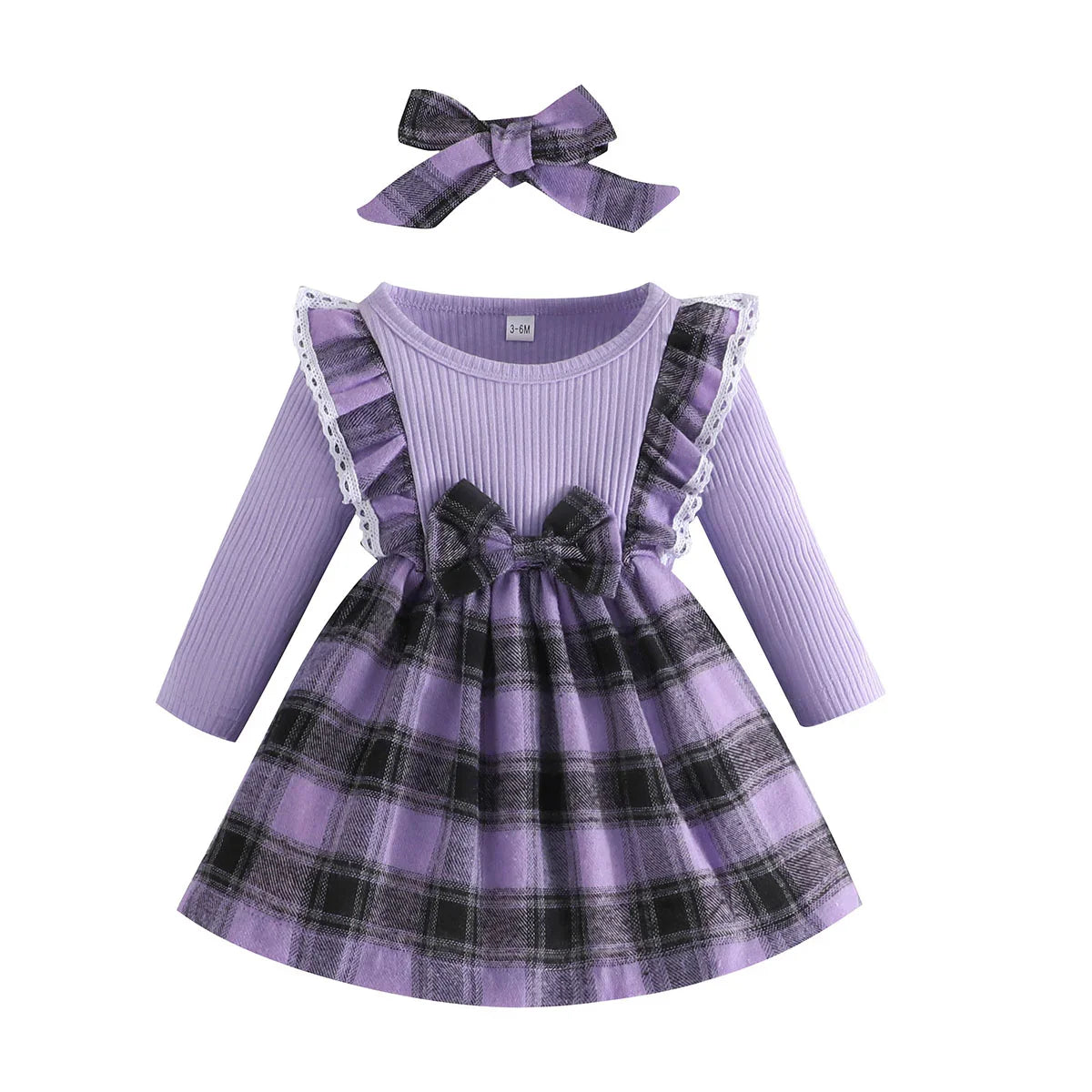Flat lay of a baby girl's plaid princess dress, highlighting the vibrant colors and quality