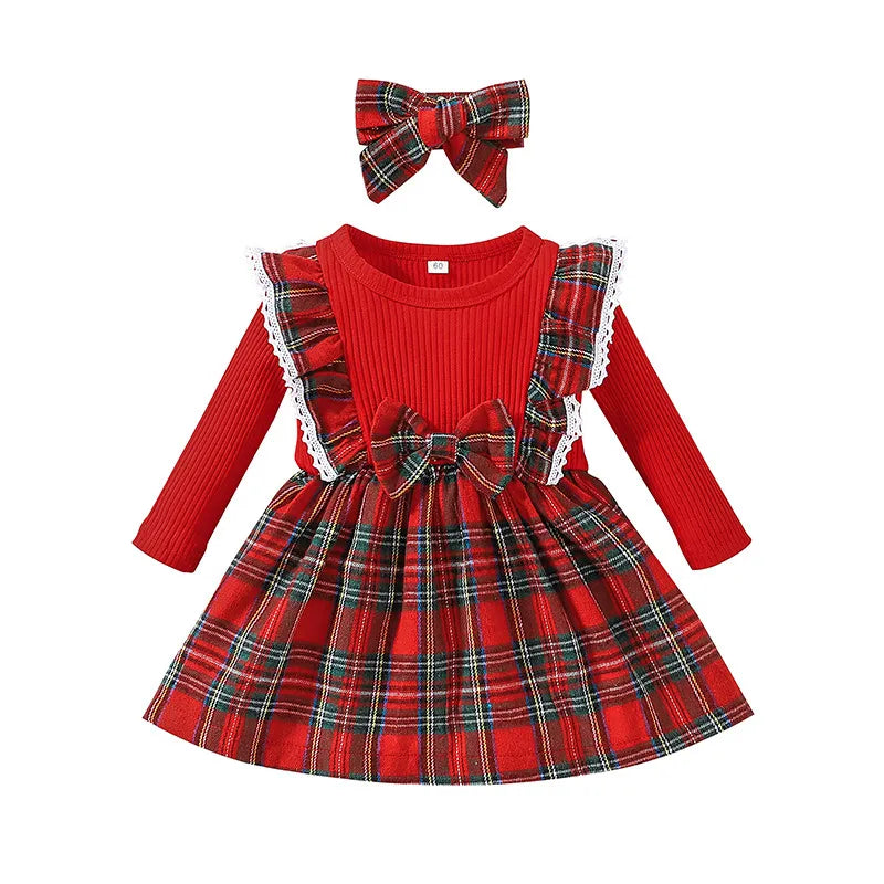 Close-up of the plaid pattern and stitching on a baby girl's cotton princess dress