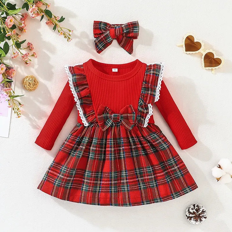 Detailed hemline of the baby girl's plaid princess dress, showing neat finishing, cotton cloth
