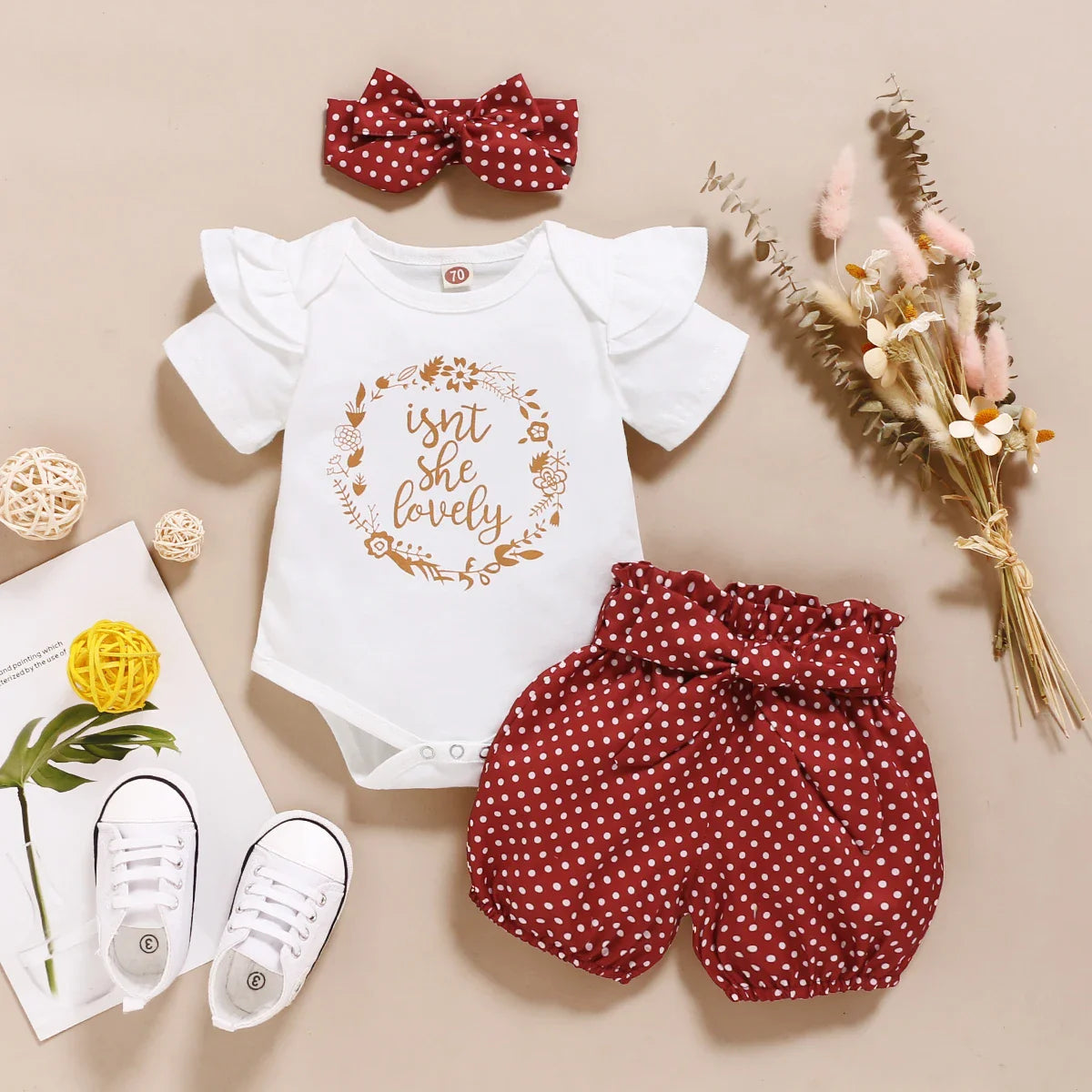 Chic baby girl in an adorable polka dot 3-piece set, perfect for playful summer days