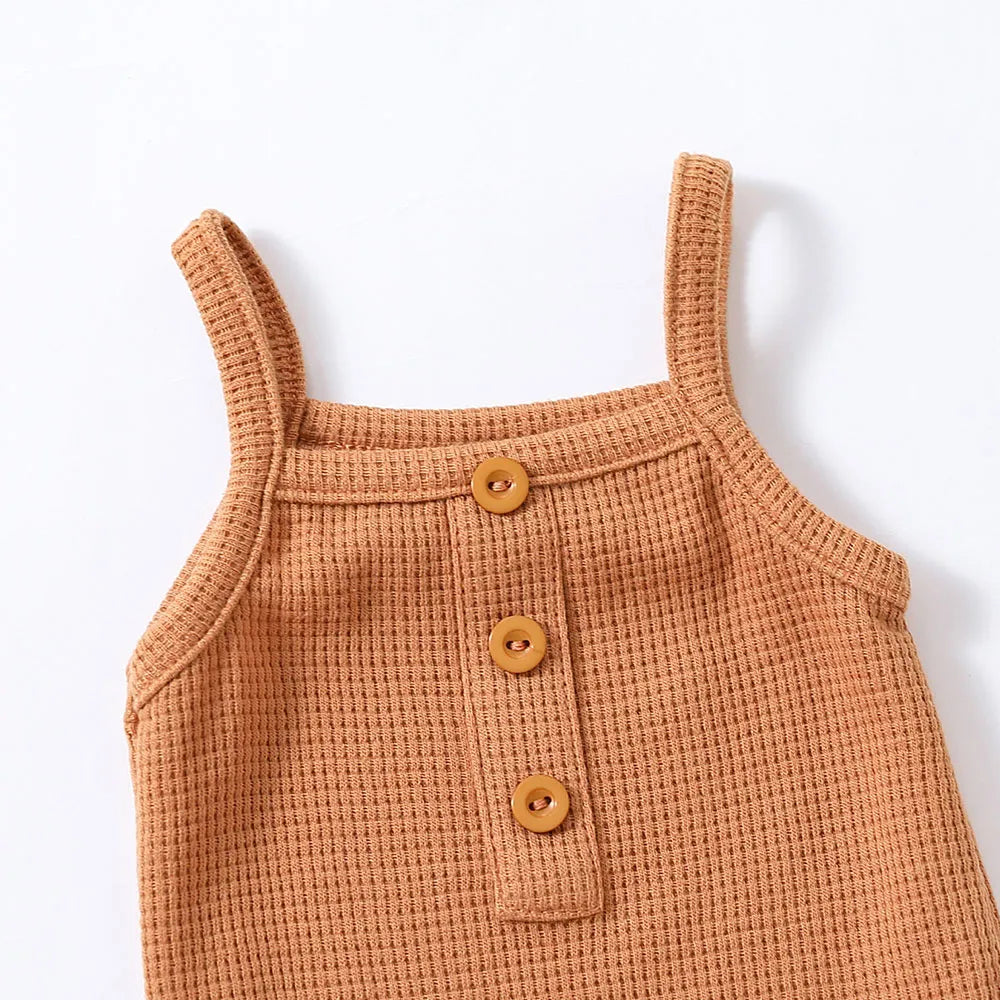 Newborn essentials: white sleeveless cotton romper with delicate lace trim, perfect for summer