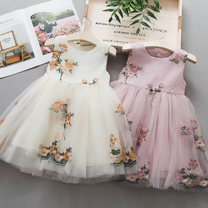 Baby girl in sleeveless floral embroidered princess dress, casual spring/summer cotton blend.