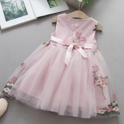 Girls' casual sleeveless floral dress, white with colorful embroidery, perfect for summer fashion.