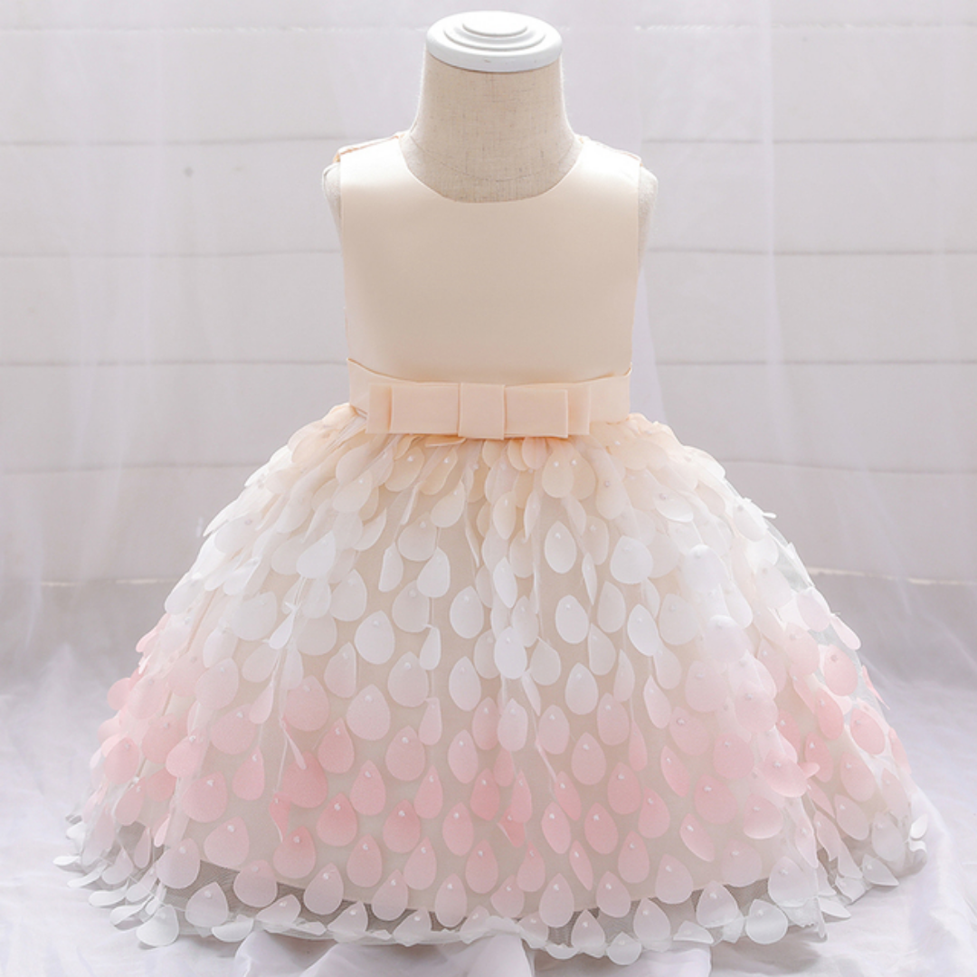 Full view of a baby girls' mermaid party dress featuring a vibrant purple bodice and a ruffled pink petal skirt