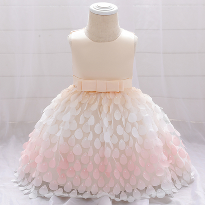 Full view of a baby girls' mermaid party dress featuring a vibrant purple bodice and a ruffled pink petal skirt