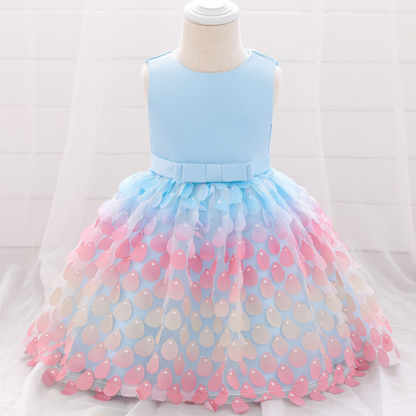 Toddler girl's special occasion mermaid dress. Blue, scaled top with a whimsical, layered pink petal skirt design