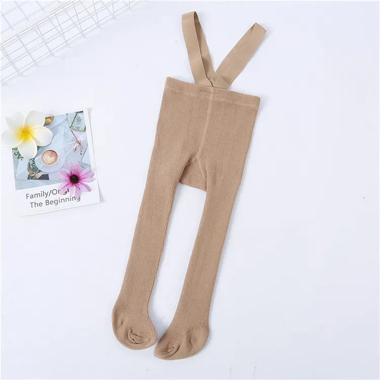 Cozy baby knit tights with adjustable shoulder straps, offering comfort and style for infants.
