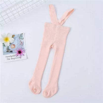 Display of various sizes of knit tights with shoulder straps for baby girls, from newborn to toddler.