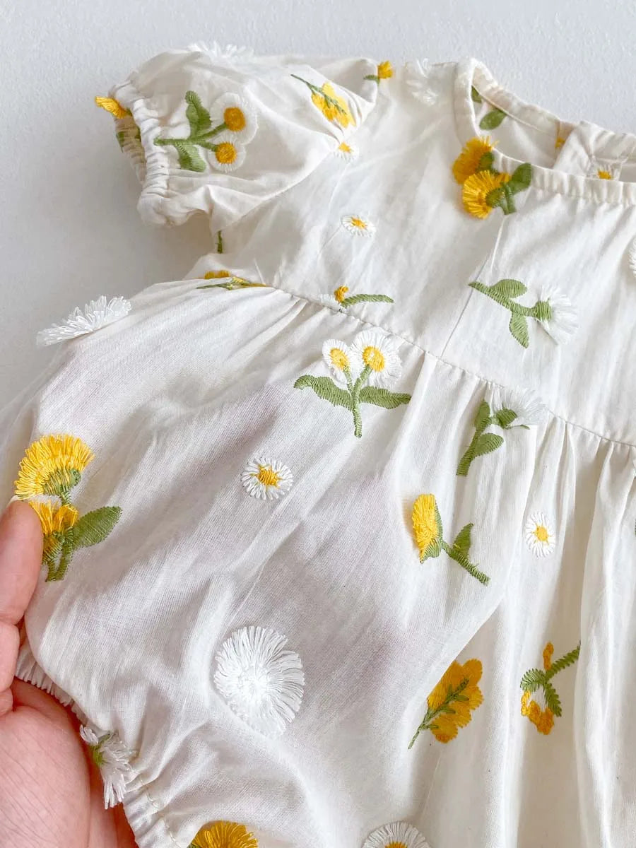 Back view of summer baby girl embroidered floral jumpsuit, comfortable cotton fabric.