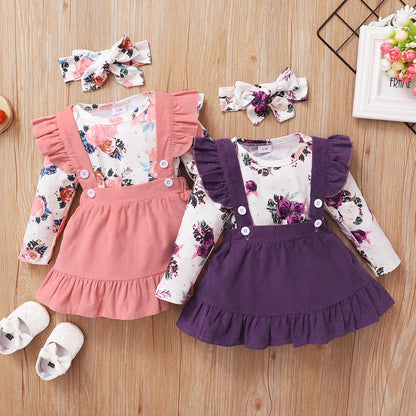 Baby girl in white floral romper and matching brown suspender skirt, newborn to 18 months autumn wear.