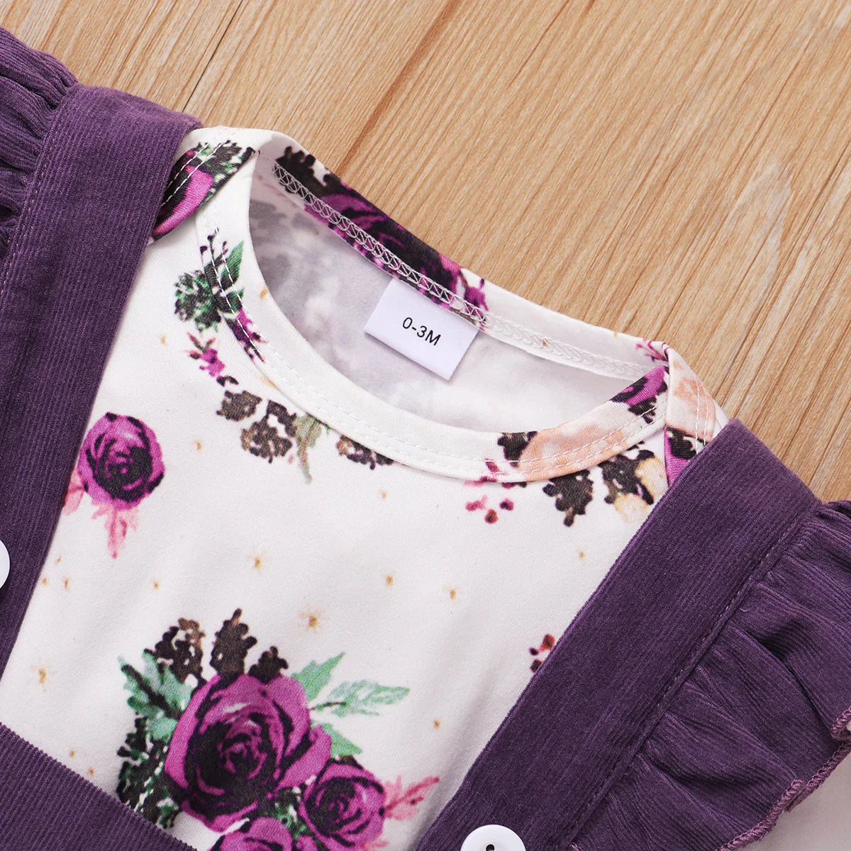Adorable baby girl's white floral print romper, designed for comfort and style, 0-18 months.