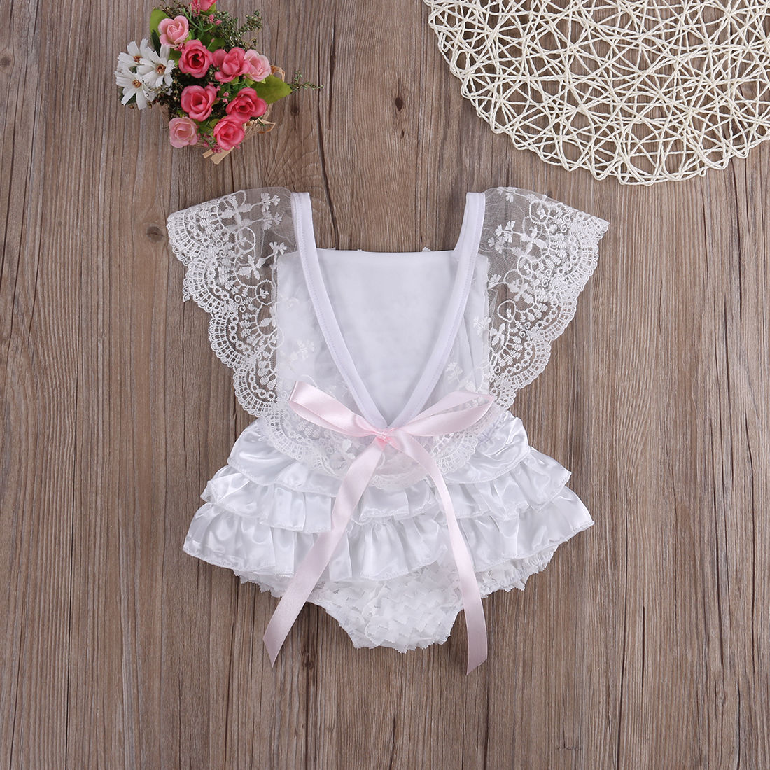 Close-up of Princess Lace Bodysuit Dress for baby girls, featuring delicate lace and soft cotton fabric.