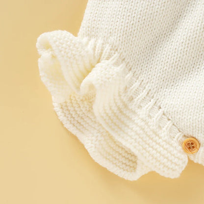 Soft pink knitted baby romper with a stylish square collar, comfortable infant wear