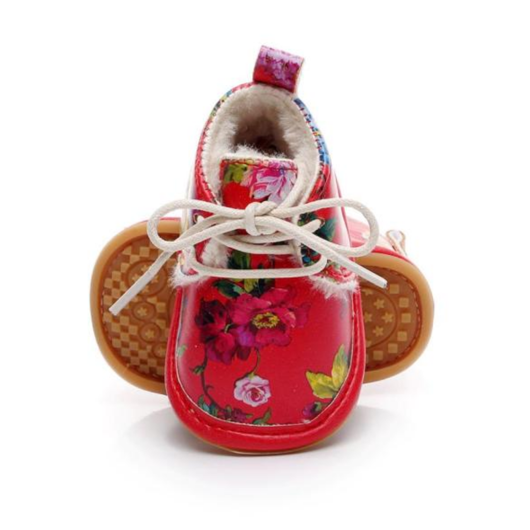Detail of soft sole on baby girl fleece snow boots, designed for first walkers