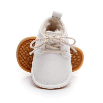 Soft pink fleece baby boots for girls, designed as first walker snow shoes