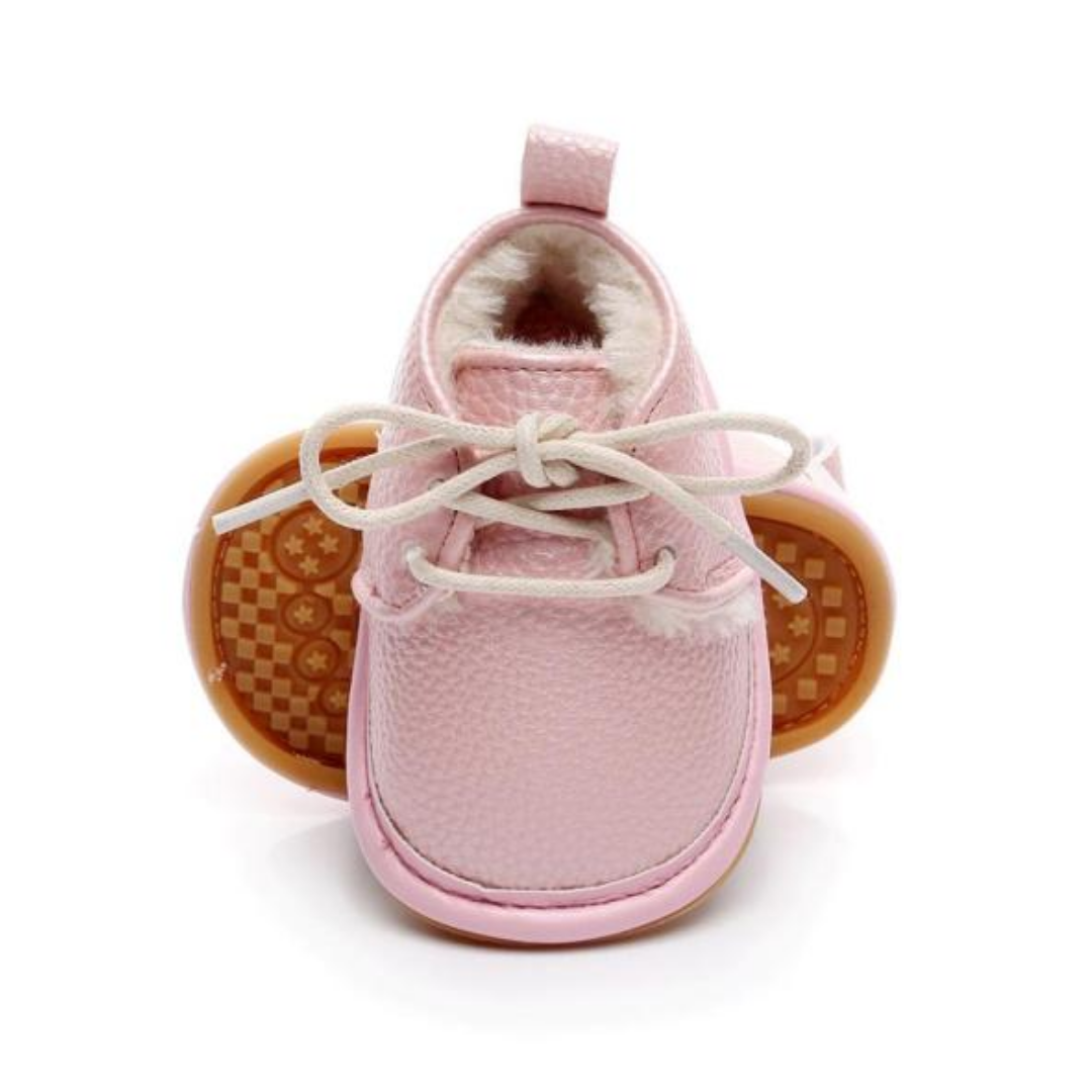 Insulated pink fleece baby girl boots, perfect for cold weather and first steps