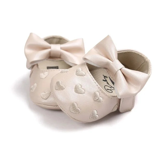 Stylish baby girl heart moccasins, ideal prewalker footwear with soft sole and bow accent