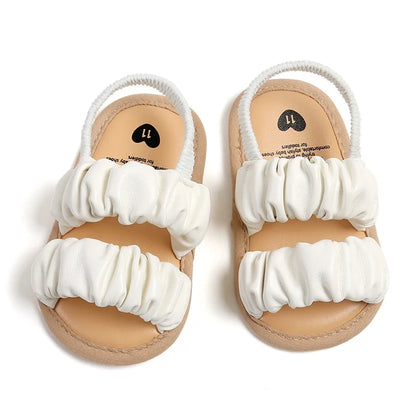 Baby girl pink soft anti-slip first step sandals with flower detail, ideal for toddlers.