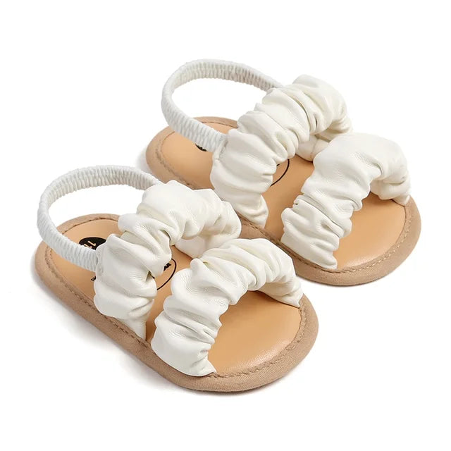 Orange baby girl first steps sandals, soft grip anti-slip design for toddlers.