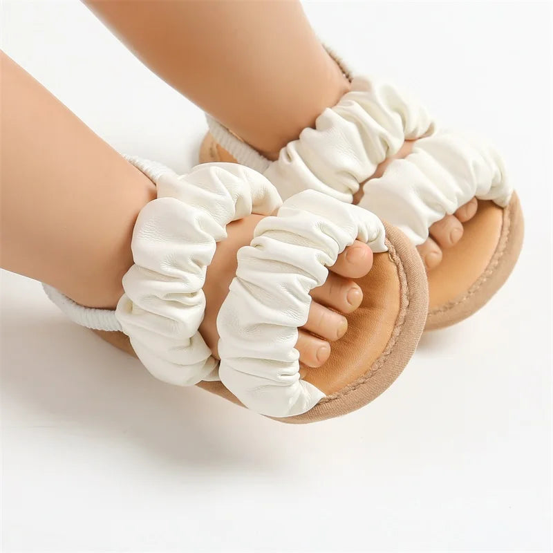 First walker baby girl sandals in purple with soft sole and anti-slip grip for infants.