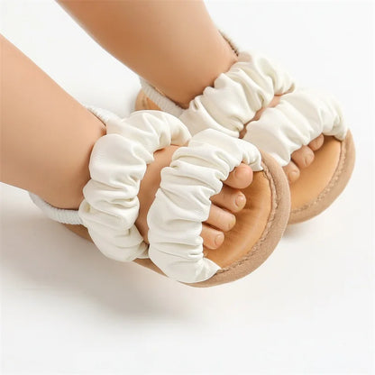 First walker baby girl sandals in purple with soft sole and anti-slip grip for infants.
