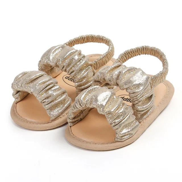 Pink baby girl first step sandals, soft sole and anti-slip for safe toddling.