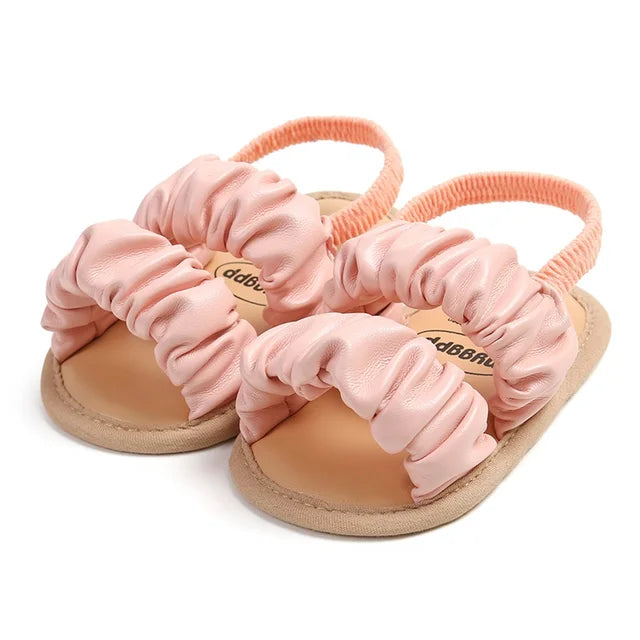 Baby girl's light blue anti-slip soft sole sandals, ideal for early walking.