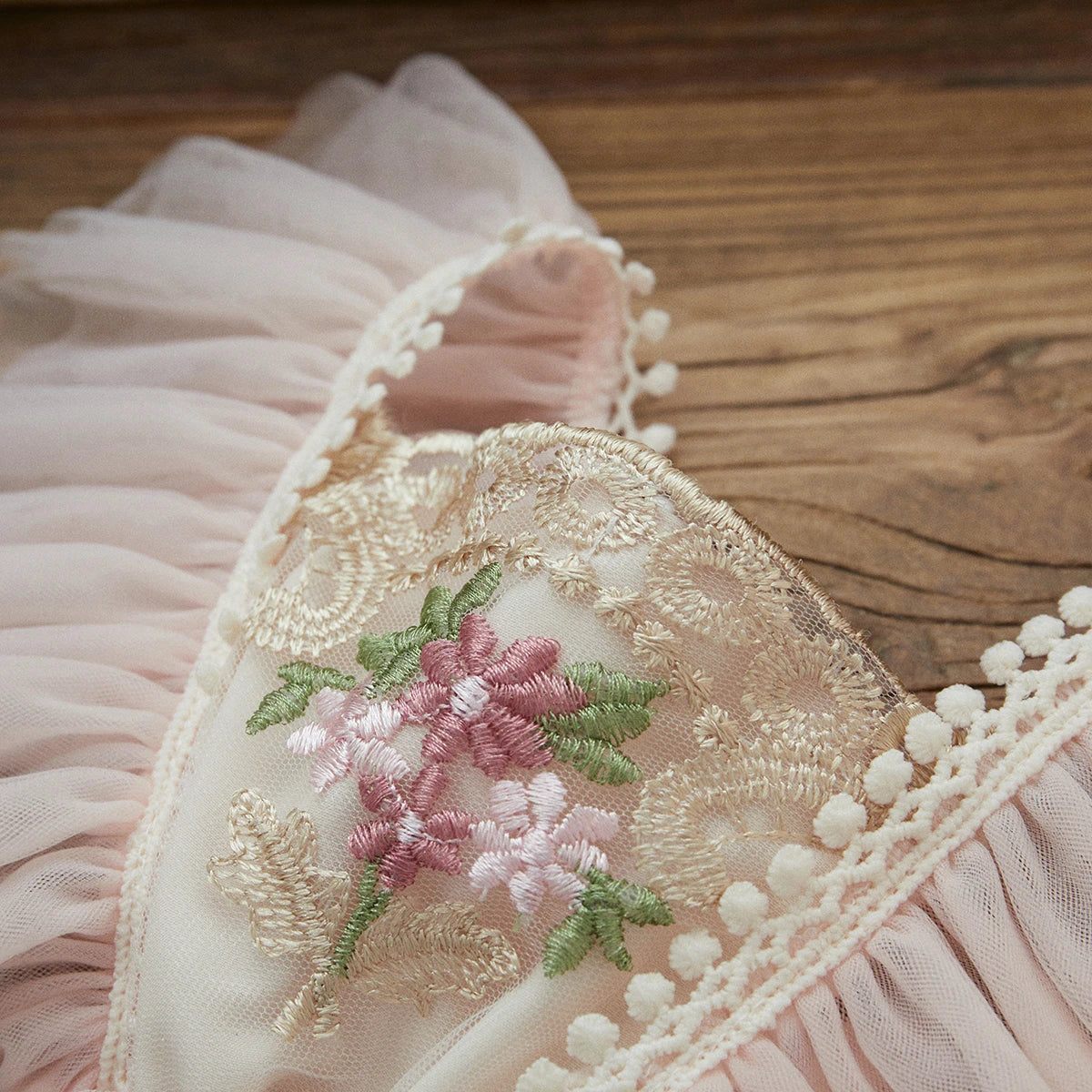 Baby girl fashion: White sleeveless princess romper with intricate floral embroidery and bow headband.