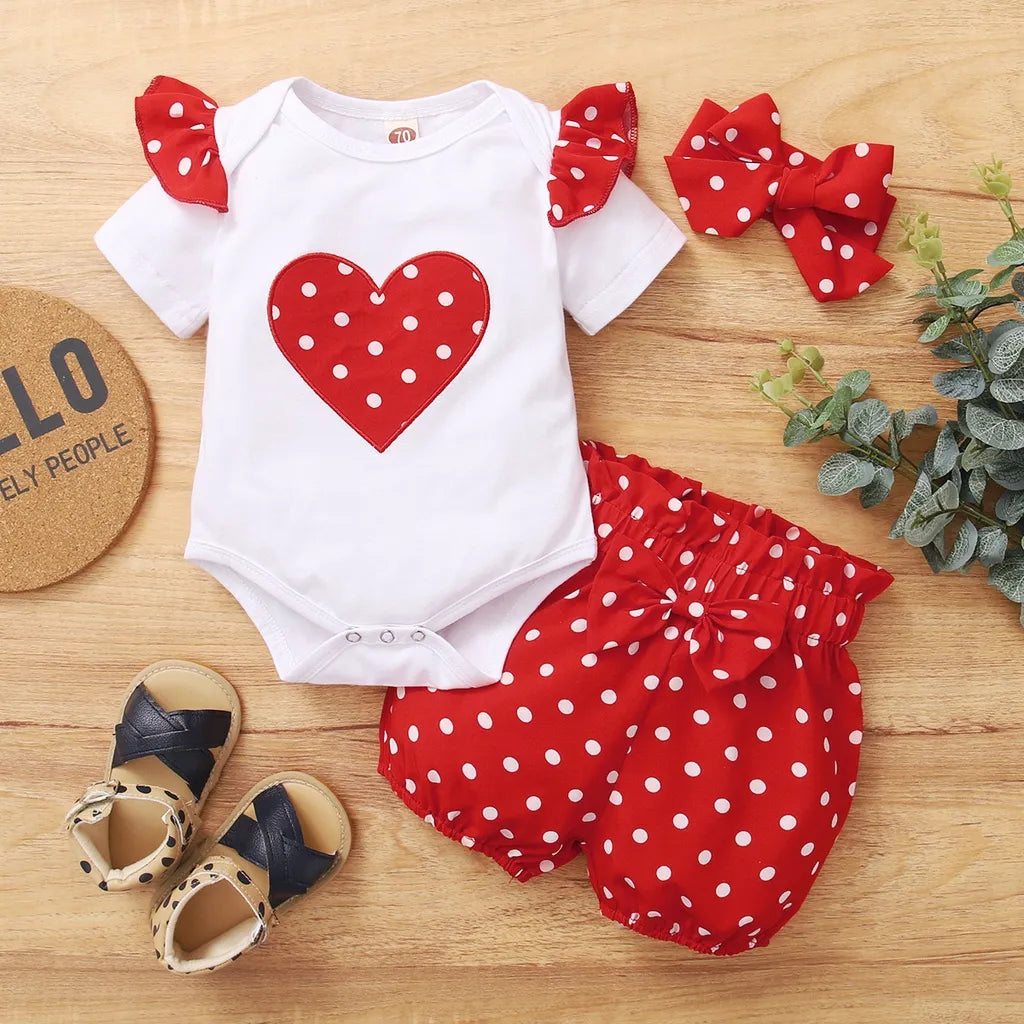 Newborn girl's red polka dot summer bodysuit set with matching shorts, soft combed cotton