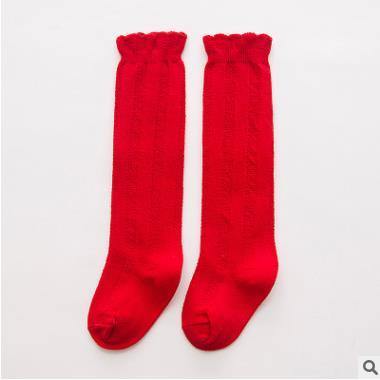 Cute pink ribbed knee-high baby socks, perfect for stylish little girls.